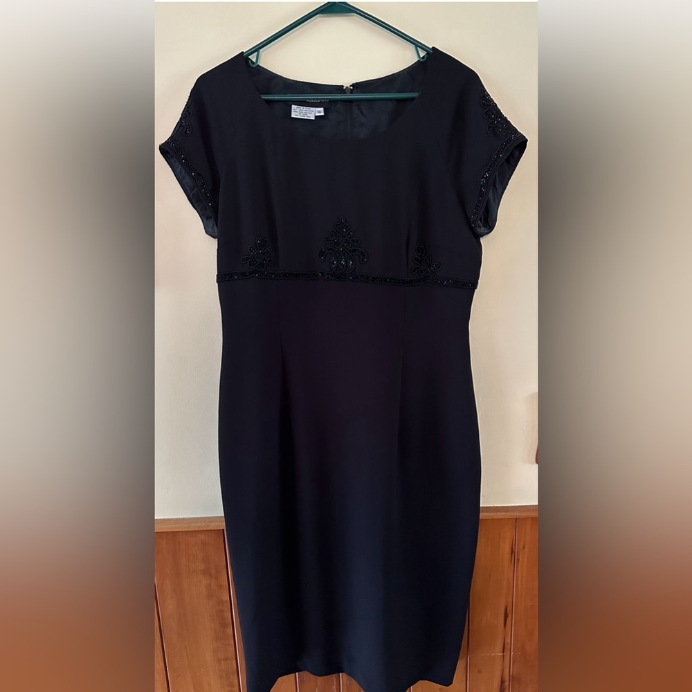Donna Morgan black dress with decorative beading on front and back. Size 10.